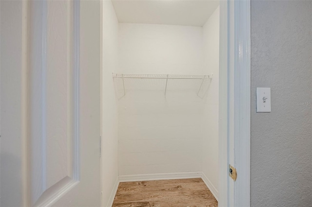 4559 W Gore Ave, Orlando, FL 32811 - walk in closet with wood finished floors