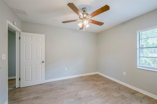 4559 W Gore Ave, Orlando, FL 32811 - empty room featuring light wood finished floors and ceiling fan