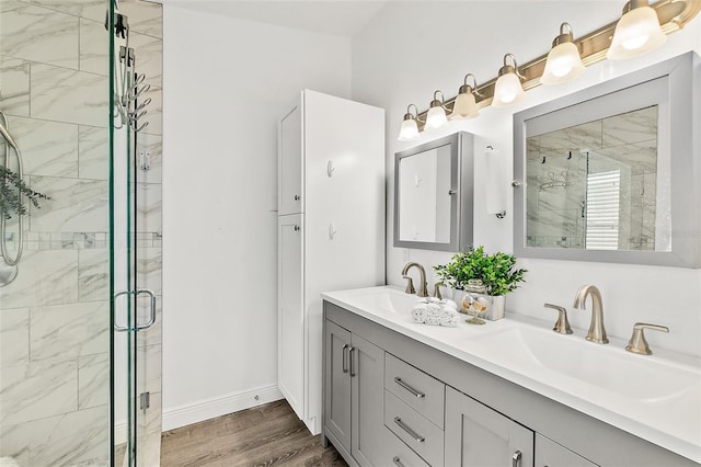 139 Douglas St, Edgewater, FL 32141 - bathroom with double vanity, a shower stall, and wood finished floors