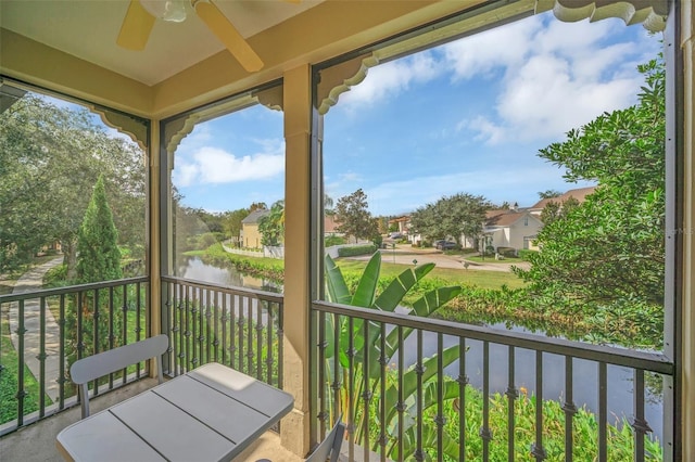 506 Mirasol Cir Unit 202, Celebration, FL 34747 - balcony with a water view, ceiling fan, and a residential view