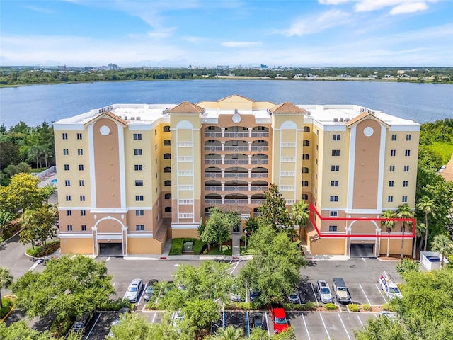 6336 Buford St Unit 209, Orlando, FL 32835 - view of apartment building / complex with a water view and uncovered parking