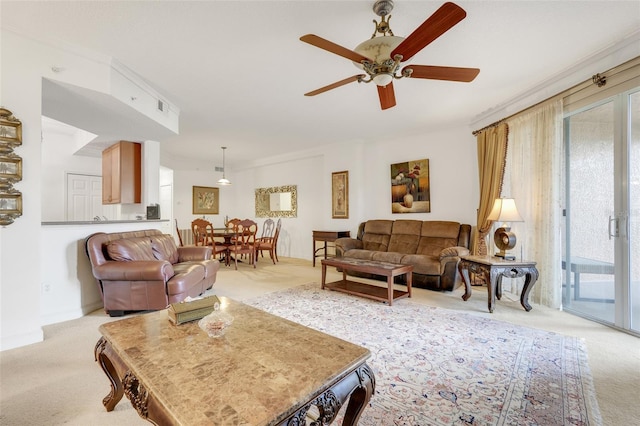 6336 Buford St Unit 209, Orlando, FL 32835 - living room with light colored carpet, ceiling fan, and ornamental molding