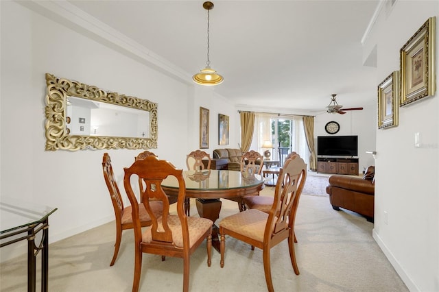6336 Buford St Unit 209, Orlando, FL 32835 - dining area featuring light colored carpet, ceiling fan, and crown molding