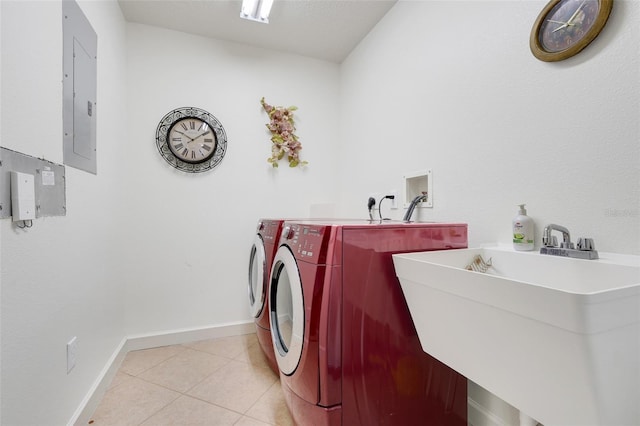 6336 Buford St Unit 209, Orlando, FL 32835 - laundry room featuring light tile patterned flooring, separate washer and dryer, and electric panel
