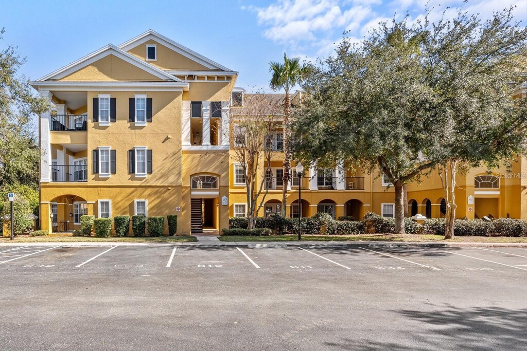 3707 Conroy Rd Unit 1715, Orlando, FL 32839 - view of property featuring uncovered parking