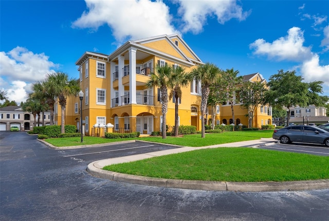3707 Conroy Rd Unit 1715, Orlando, FL 32839 - view of building exterior featuring uncovered parking