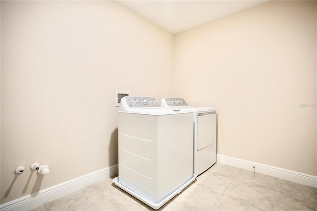 1023 Sugarwood St, Davenport, FL 33837 - washroom featuring washer and dryer and light tile patterned flooring