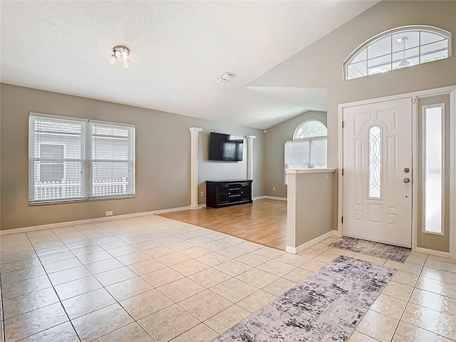 2641 Delcrest Dr, Orlando, FL 32817 - foyer with light tile patterned flooring and lofted ceiling