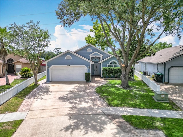 2641 Delcrest Dr, Orlando, FL 32817 - view of front of property featuring an attached garage and concrete driveway