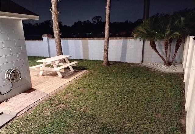 2641 Delcrest Dr, Orlando, FL 32817 - yard at twilight with a fenced backyard