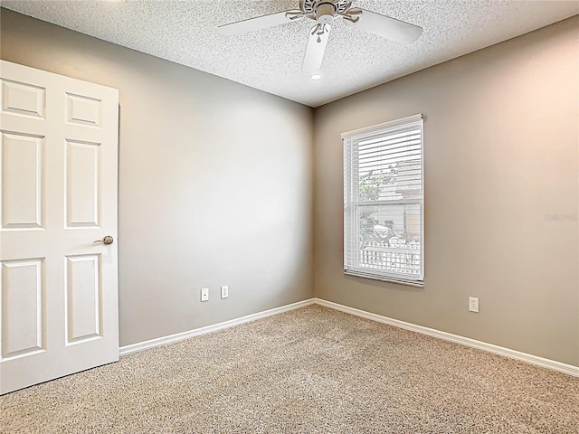 2641 Delcrest Dr, Orlando, FL 32817 - carpeted empty room featuring a ceiling fan and a textured ceiling