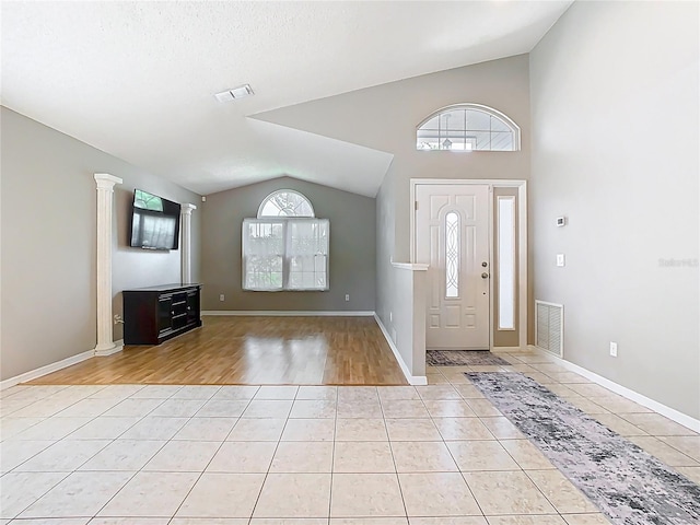 2641 Delcrest Dr, Orlando, FL 32817 - foyer entrance featuring lofted ceiling and light tile patterned flooring