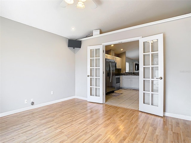 2641 Delcrest Dr, Orlando, FL 32817 - empty room with french doors, light wood-style floors, ceiling fan, and recessed lighting