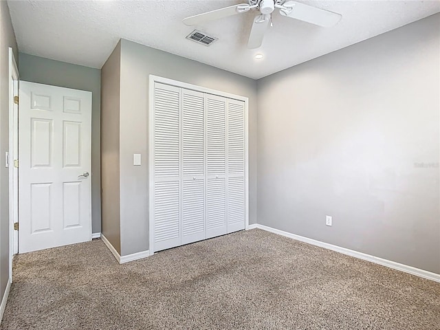 2641 Delcrest Dr, Orlando, FL 32817 - unfurnished bedroom with carpet flooring, a closet, and a ceiling fan
