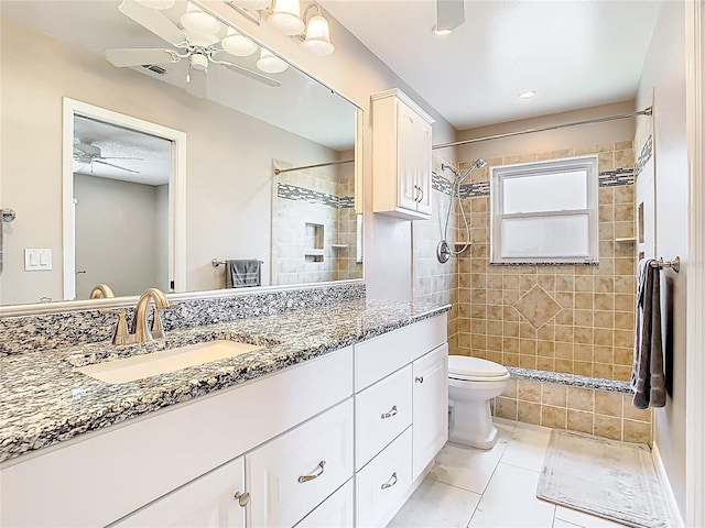 2641 Delcrest Dr, Orlando, FL 32817 - full bath with ceiling fan, vanity, tile patterned flooring, and a tile shower