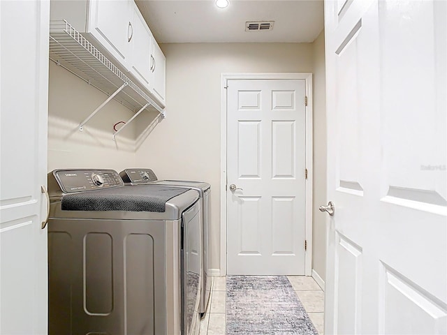 2641 Delcrest Dr, Orlando, FL 32817 - laundry room with washer and clothes dryer and light tile patterned floors