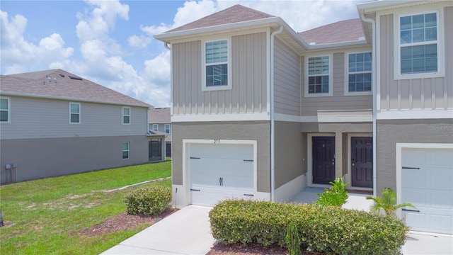 275 Blueberry Ln, Davenport, FL 33837 - multi unit property with board and batten siding, an attached garage, and a front yard