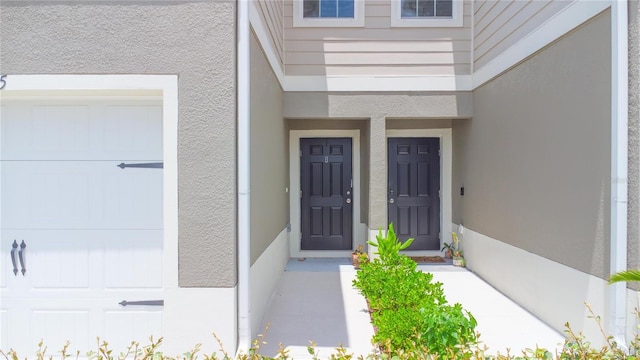 275 Blueberry Ln, Davenport, FL 33837 - doorway to property featuring stucco siding