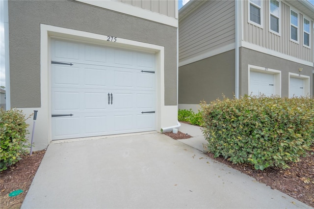 275 Blueberry Ln, Davenport, FL 33837 - garage featuring concrete driveway