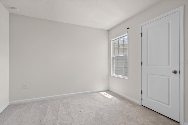 275 Blueberry Ln, Davenport, FL 33837 - carpeted empty room with baseboards and a smoke detector