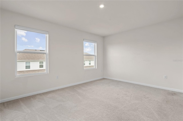 275 Blueberry Ln, Davenport, FL 33837 - unfurnished room with light carpet and recessed lighting