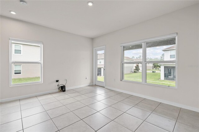 275 Blueberry Ln, Davenport, FL 33837 - unfurnished room with a smoke detector, light tile patterned floors, and recessed lighting