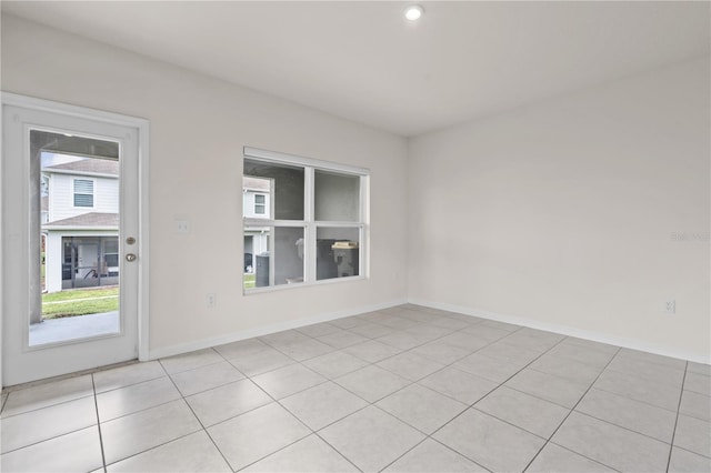 275 Blueberry Ln, Davenport, FL 33837 - unfurnished room with light tile patterned floors and baseboards