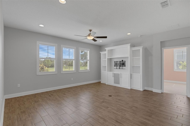 32004 Redtail Reserve Blvd, Sorrento, FL 32776 - unfurnished living room with ceiling fan, wood finished floors, and recessed lighting