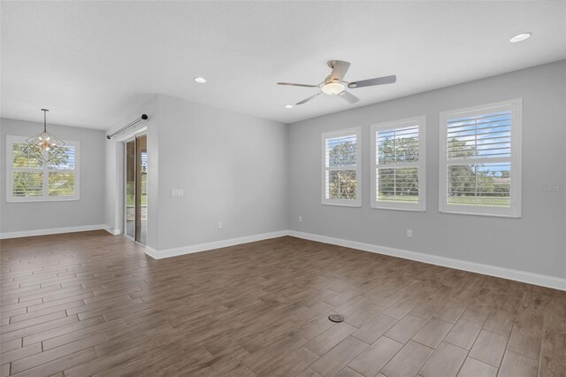 32004 Redtail Reserve Blvd, Sorrento, FL 32776 - unfurnished room featuring healthy amount of natural light, a ceiling fan, dark wood-type flooring, and recessed lighting