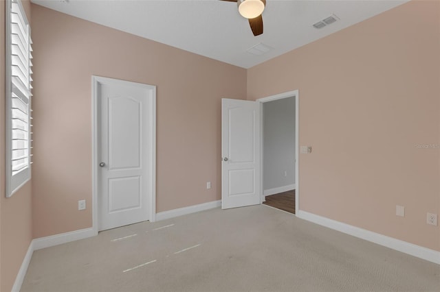 32004 Redtail Reserve Blvd, Sorrento, FL 32776 - unfurnished bedroom with carpet flooring and a ceiling fan