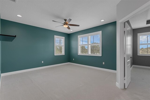 32004 Redtail Reserve Blvd, Sorrento, FL 32776 - unfurnished bedroom with light colored carpet, a textured ceiling, ceiling fan, and recessed lighting
