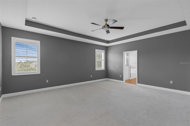 32004 Redtail Reserve Blvd, Sorrento, FL 32776 - unfurnished room with a tray ceiling, ceiling fan, light carpet, and a smoke detector