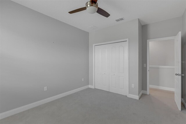 32004 Redtail Reserve Blvd, Sorrento, FL 32776 - unfurnished bedroom featuring carpet floors, a closet, and ceiling fan