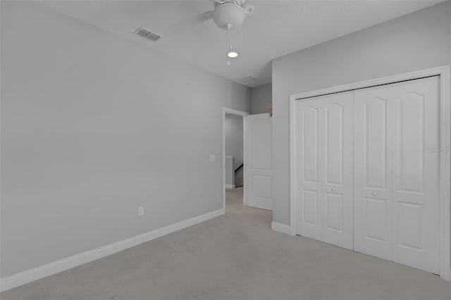 32004 Redtail Reserve Blvd, Sorrento, FL 32776 - unfurnished bedroom with a closet, light colored carpet, and a ceiling fan