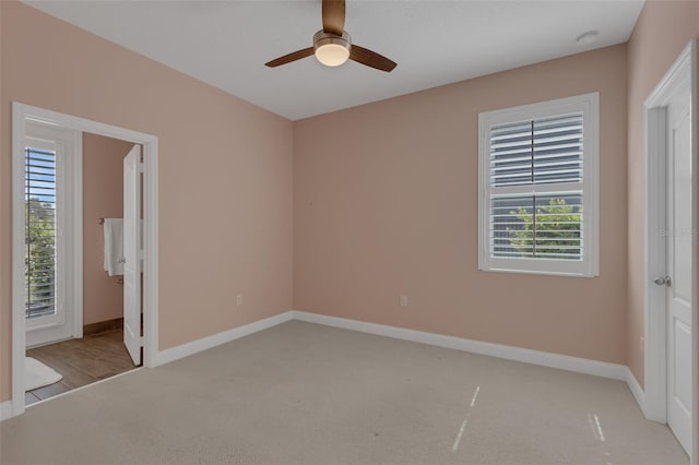 32004 Redtail Reserve Blvd, Sorrento, FL 32776 - unfurnished bedroom featuring light colored carpet and ceiling fan