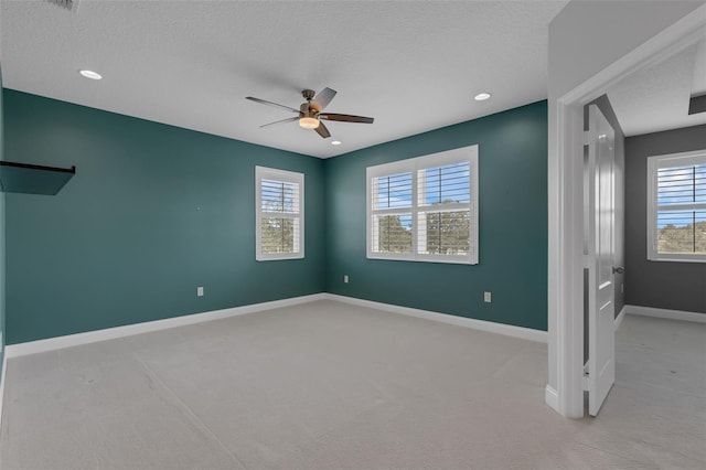 32004 Redtail Reserve Blvd, Sorrento, FL 32776 - unfurnished bedroom with light colored carpet, a textured ceiling, ceiling fan, and recessed lighting
