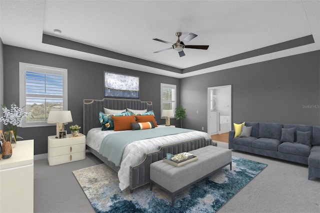 32004 Redtail Reserve Blvd, Sorrento, FL 32776 - carpeted bedroom featuring a raised ceiling, multiple windows, ceiling fan, and ensuite bath