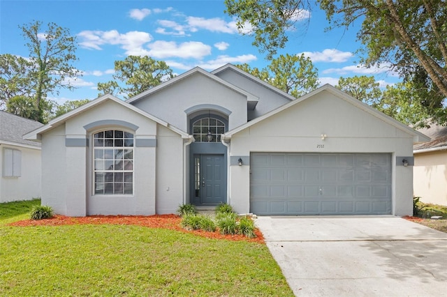 2767 Aragon Ter, Lake Mary, FL 32746 - view of front facade featuring an attached garage, stucco siding, a front lawn, and concrete driveway