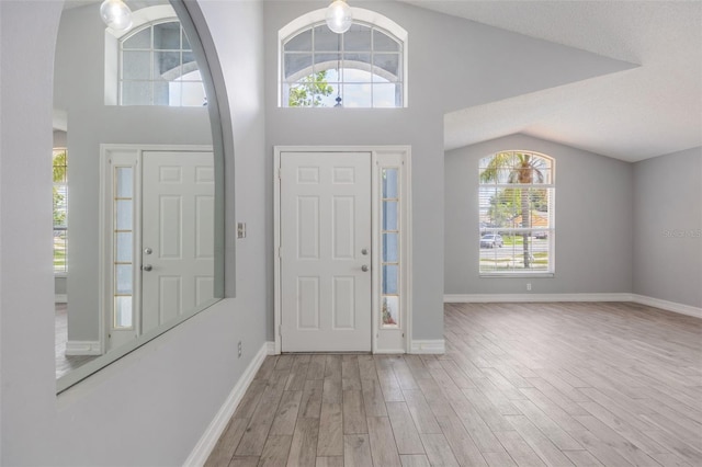2767 Aragon Ter, Lake Mary, FL 32746 - entryway with wood finished floors, healthy amount of natural light, and high vaulted ceiling