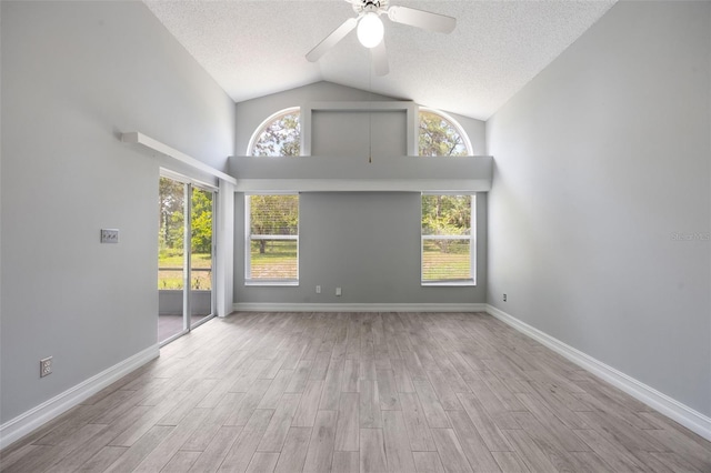 2767 Aragon Ter, Lake Mary, FL 32746 - empty room with ceiling fan, a textured ceiling, high vaulted ceiling, and wood finished floors