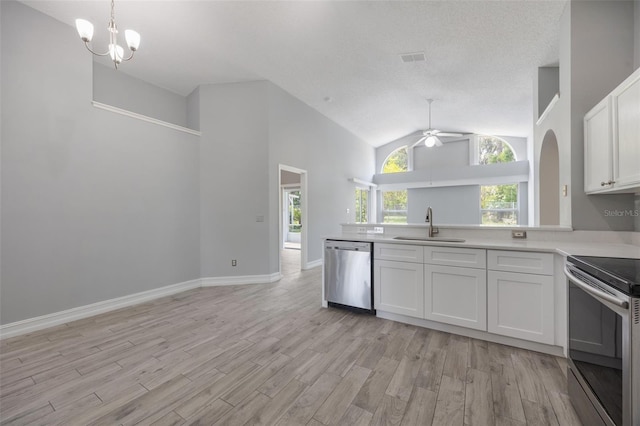 2767 Aragon Ter, Lake Mary, FL 32746 - kitchen featuring stainless steel appliances, open floor plan, ceiling fan, white cabinets, and light wood-style flooring