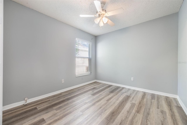 2767 Aragon Ter, Lake Mary, FL 32746 - unfurnished room with a textured ceiling, light wood-style floors, and a ceiling fan