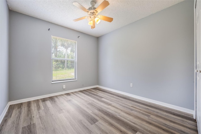 2767 Aragon Ter, Lake Mary, FL 32746 - empty room with wood finished floors, a textured ceiling, and ceiling fan