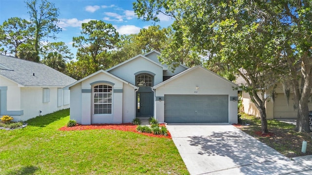 2767 Aragon Ter, Lake Mary, FL 32746 - view of front facade featuring a garage, stucco siding, driveway, and a front yard