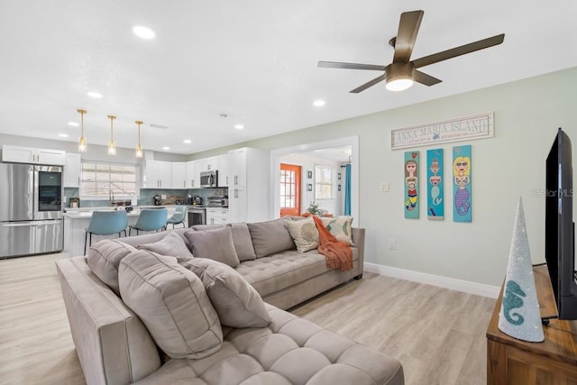 4311 123rd St W, Cortez, FL 34215 - living area featuring a ceiling fan, light wood-style flooring, and recessed lighting