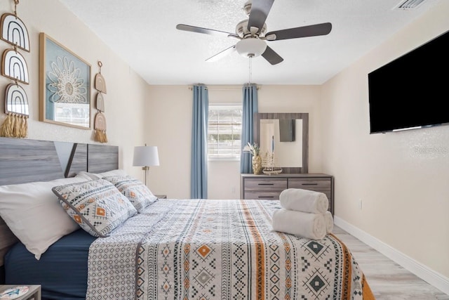4311 123rd St W, Cortez, FL 34215 - bedroom with wood finished floors and a ceiling fan