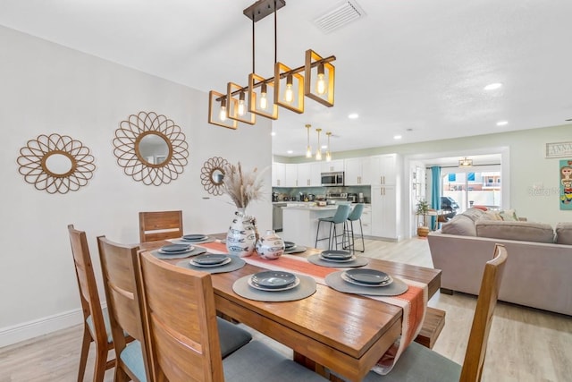 4311 123rd St W, Cortez, FL 34215 - dining room with light wood-type flooring and recessed lighting