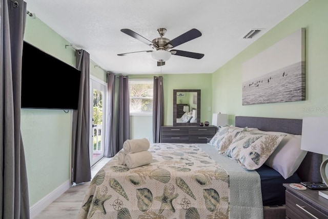 4311 123rd St W, Cortez, FL 34215 - bedroom featuring wood finished floors and ceiling fan