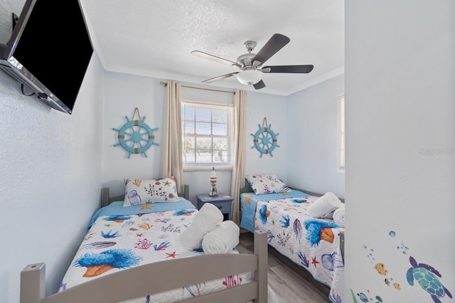 4311 123rd St W, Cortez, FL 34215 - bedroom with wood finished floors, ceiling fan, and crown molding