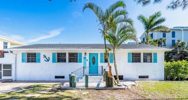 4311 123rd St W, Cortez, FL 34215 - view of front of home featuring crawl space and brick siding
